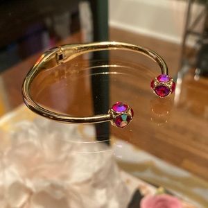 Kate Spade Lady Marmalade hinge bangle bracelet. Gold, iridescent pink stones